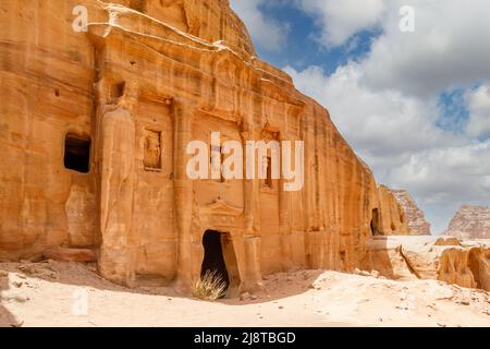 Ancient tomb of Roman soldier and funeral ballroom carved in sandstone rock, Petra, Jordan Stock Photo