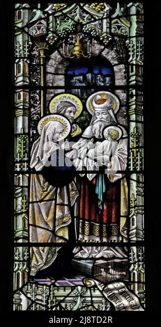 Stained glass window by Percy Bacon & Brothers depicting Presentation in the Temple, St Martin of Tours, North Nibley, Gloucestershire Stock Photo