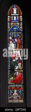 A stained glass window by Clayton & Bell depicting The Deposition, St Martin's Church, North Nibley, Gloucestershire Stock Photo