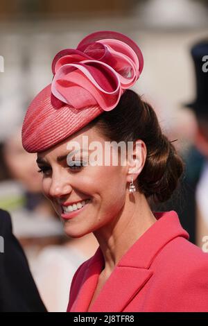 The Duchess of Cambridge speaks to guests attending a Royal Garden Party at Buckingham Palace in London. Picture date: Wednesday May 18, 2022. Stock Photo