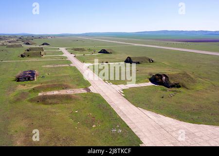 Aerial view of Military Aircraft Hangars on Abandoned Big Shiraki Soviet, russian airbase in Georgia country, Georgia Stock Photo