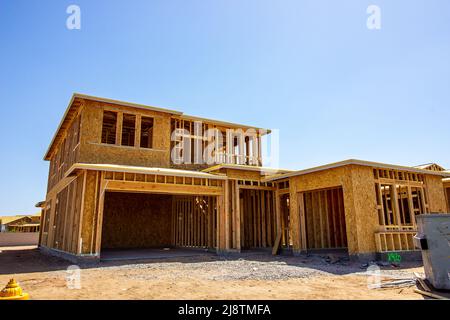 New Two Story Home Under Construction During Framing Stage Stock Photo