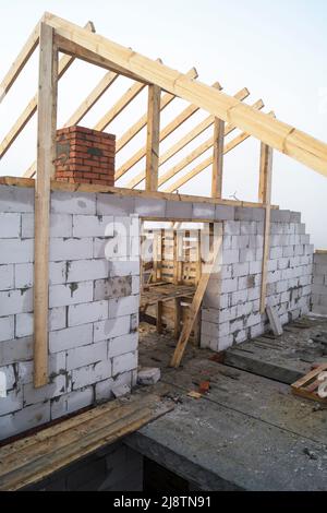 Construction of the new building from brick on background misty sky Stock Photo