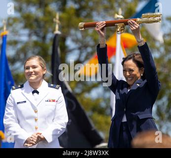 United States Vice President Kamala Harris (R) stands with Class President Samantha Ashely Bolin (L) as Harris holds aloft a gift from the 2022 graduating class of the United States Coast Guard Academy, at Cadet Memorial Field in New London, Connecticut, USA, 18 May 2022. Stock Photo