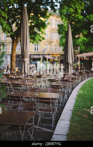 Empty outdoor restaurant in nature without dish on the wooden table Stock Photo