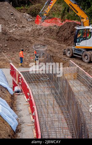 Oltre il Colle Colle Bergamo Italy November 11, 2017: Carpentry workers to build sewage purifiers Stock Photo
