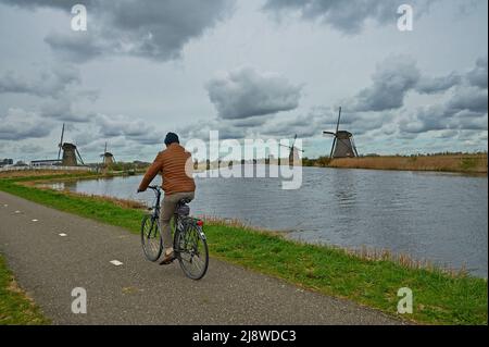 Windmills at Kinderdijk, South Holland in the Netherlands line the Molentocht. This UNESCO world heritage site lies north of Alblasserdam. Stock Photo