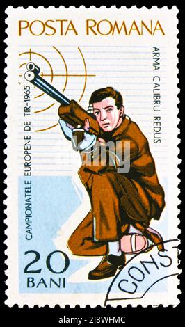 MOSCOW, RUSSIA - MAY 14, 2022: Postage stamp printed in Romania shows Rifleman kneeling, European Shooting Championships, Bucharest serie, circa 1965 Stock Photo