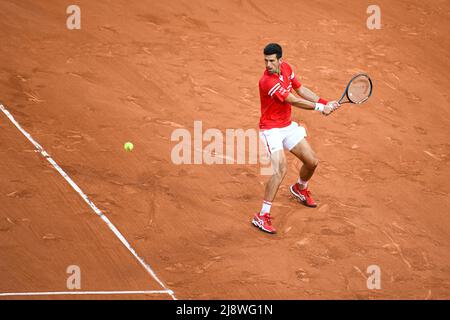 Novak Djokovic hits a backhand during a men's singles semifinal match ...