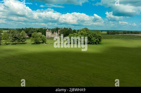 View of Chateau de Thoury in Saint-Pourain-sur-Besbre in Auvergne, feudal castle with fortified high curtain walls enclosing a courtyard, gate tower e Stock Photo