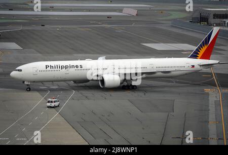 A Philippine Airlines Airbus A321 passenger plane taxis to a gate at San Francisco International Airport in San Francisco, California. Stock Photo