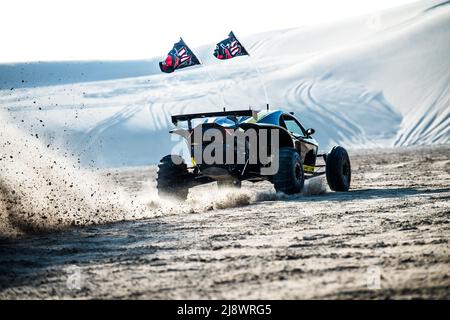 Doha, Qatar, February 23, 2018: Off road buggy car in the sand dunes of the Qatari desert. Stock Photo