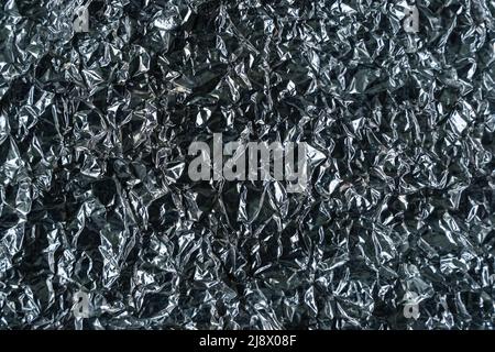 Abstract texture pattern metallic paper using as a background or wallpaper. Metal aluminum foil shiny and reflector. High quality photo Stock Photo