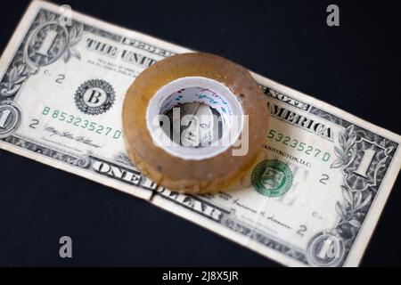 A tape and 1 dollar Stock Photo