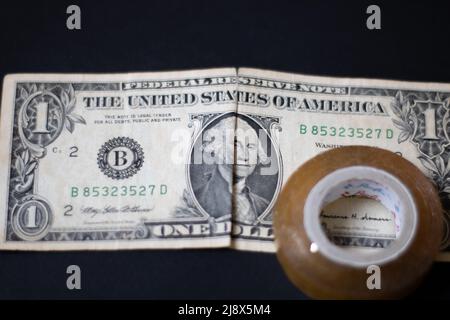 A tape and 1 dollar Stock Photo