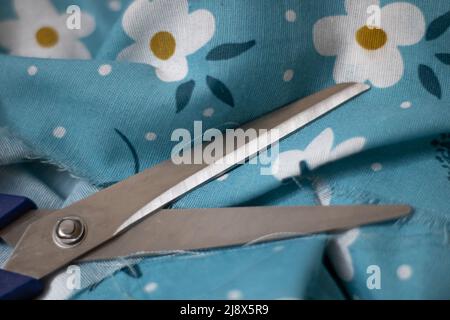 Scissors on fabric Stock Photo