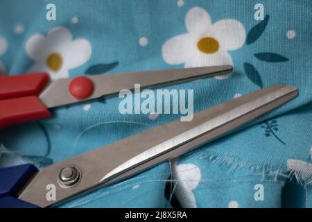 Scissors on fabric Stock Photo