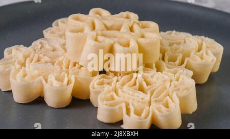 Malaysian Kuih Raya called Kuih Goyang or Kuih Ros. Popular traditional kuih raya on Hari Raya Aidilfitri in Malaysia. Stock Photo