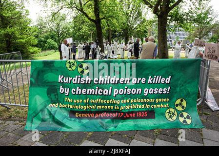 A banner illustrating the killing by chemical gases of Iraqi Kurdish children seen during the demonstration close to the Organisation for the Prohibition of Chemical Weapons (OPCW) building in The Hague, condemning the use of chemical weapons by Turkey. A delegation from Britain had intended to visit the Orgainisation for the Prohibition of Chemical Weapons (OPCW), in The Hague, today to press for action from the watchdog. Steve Sweeney, had spent more than a year documenting Turkey's alleged use of chemical weapons in Iraqi Kurdistan with findings that included testimonies from Kurdish villag Stock Photo