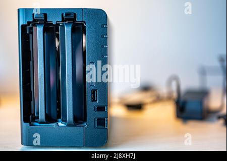 network attached storage NAS with a single bay pulled setup at a home office and remote work redundancy Stock Photo
