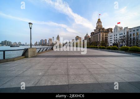 The Bund (Waitan), usually packed with thousands of visitors every day, is eerily empty on the night before Shanghai initiates a citywide lockdown. Stock Photo