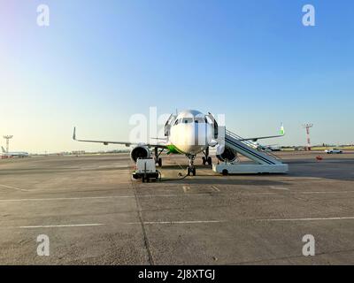 passenger plane is parked at the airport Stock Photo