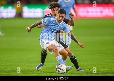 Washington, DC, USA. 18th May, 2022. New York City midfielder Santiago RodrÃ-guez (20) blocks D.C. United midfielder Sofiane Djeffal (13) from the ball during the MLS match between the New York City FC and the DC United at Audi Field in Washington, DC. Reggie Hildred/CSM/Alamy Live News