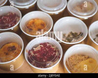 Take-away food in disposable bowls of craft paper. Concept of daily ready menu, food delivery, eco-friendly carton packaging, environment protection Stock Photo