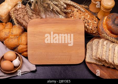 Assortment of baked bread on grey background. Gluten free breads . Stock Photo