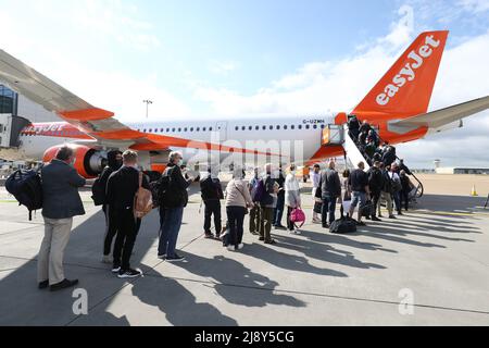 File photo dated 17/05/21 of passengers prepare to board an easyJet flight to Faro, Portugal, at Gatwick Airport in West Sussex, as the airline hopes to be back to carrying nearly as many customers at the end of this financial year as it did before the pandemic. Stock Photo