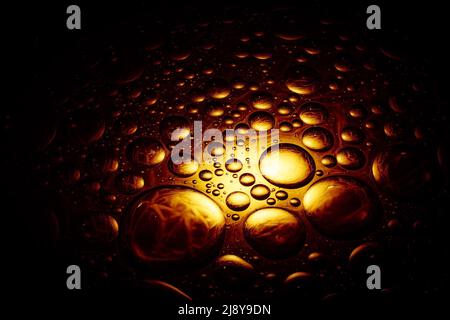 Dark abstract bubbles background with bright golden yellow sporlight Stock Photo