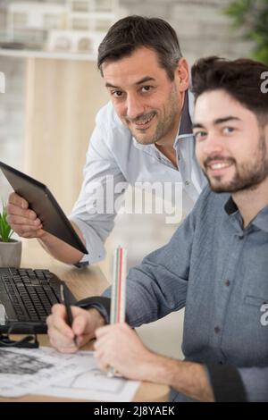 successful two architects in casual wear communicating Stock Photo