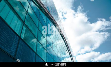 Abstract fragment of modern architecture, walls made of glass and concrete. High quality photo Stock Photo