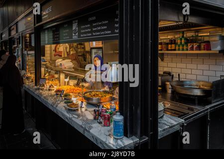 One of the plethora of food kiosks serving cuisine from all over the world at Camden Market. Stock Photo