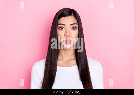 Photo of flirty millennial brunette lady blow kiss wear trend cloth isolated on pink color background Stock Photo