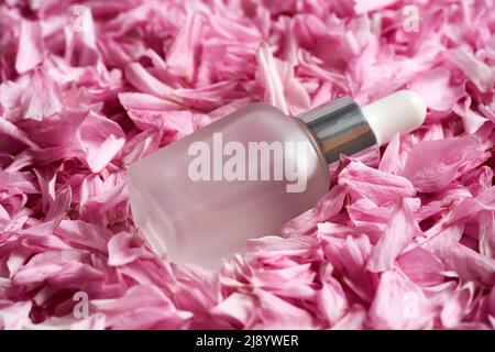 A bottle of essential oil with pink japanese kwanzan cherry blossoms Stock  Photo - Alamy