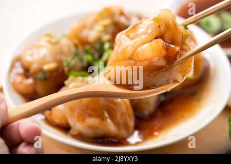 Close up of Bawan (Ba wan), Taiwanese meatball delicacy, delicious street food, steamed starch wrapped round shaped dumpling with pork and shrimp insi Stock Photo