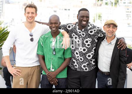 Jonas Bloquet, Alassane Diong, Omar Sy and Mathieu Vadepied attend the photocall for Tirailleurs (Father And Soldier) during the 75th annual Cannes film festival at Palais des Festivals on May 19, 2022 in Cannes, France. Photo by David Niviere/ABACAPRESS.COM Credit: Abaca Press/Alamy Live News Stock Photo