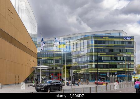 Finnish and Ukrainian flags flying in front of Helsinki main library Stock Photo