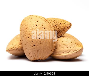 Close up photo of dried shelled almonds on isolated white background. Stock Photo