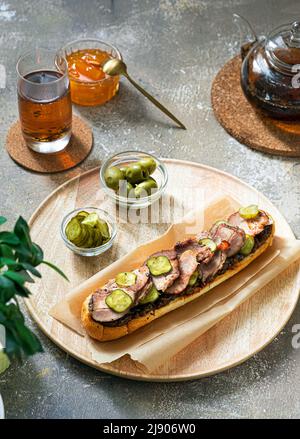 Homemade sandwich with turkey, pickles and egg for breakfast, copy space Stock Photo