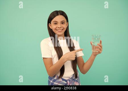 stay hydrated. kid hold glass of mineral water. child feel thirsty. Stock Photo