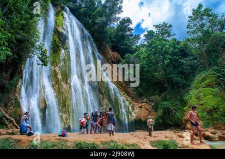 Tourists in the scenic cascade of El Limon waterfall in jungles of Samana peninsula in Dominican Republic. Amazing summer look of cascade in tropical Stock Photo