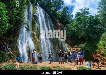 Tourists in the scenic cascade of El Limon waterfall in jungles of Samana peninsula in Dominican Republic. Amazing summer look of cascade in tropical Stock Photo
