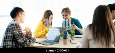 Business meeting time. Colleagues present their ideas and analyze plans during meeting in loft office of modern business center. Business team Stock Photo