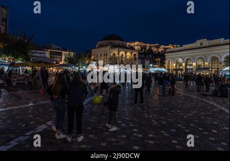 Athens Old Town, Attica - Greece - 12 28 2019 Locals and tourists walking over the Monastiraki Square by night Stock Photo