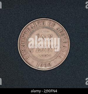 Reverse side of an Australian one penny coin coin from 1932, made of bronze, on a black surface Stock Photo