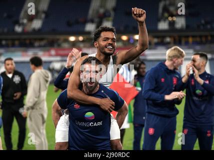 Huddersfield Town's Duane Holmes and goalkeeping coach Paul Clements celebrate following the Sky Bet League Two play-off semi-final, second leg match at Vale Park, Stoke-on-Trent. Picture date: Thursday May 19, 2022. Stock Photo