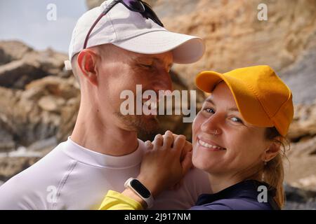 Couple on a beach hugging Stock Photo