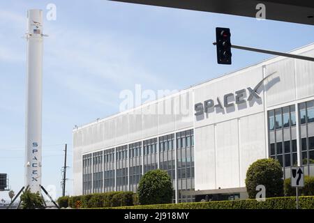Exterior view of the SpaceX headquarters with recovered Falcon 9 rocket booster on display in Hawthorne, California, seen on Tuesday, May 10, 2022. Stock Photo
